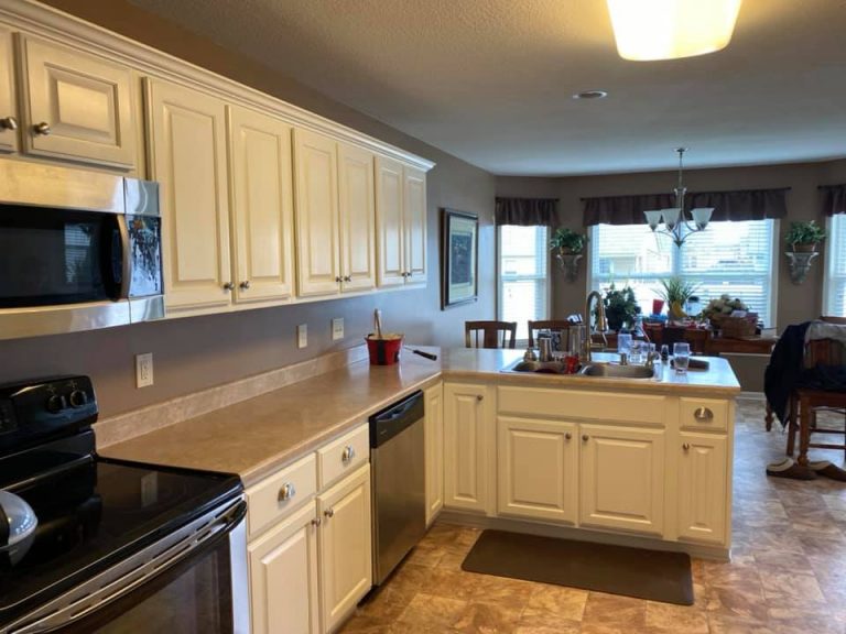 Remodeling Contractor in Fort Wayne IN outdated kitchen with wallpaper covered cabinetry